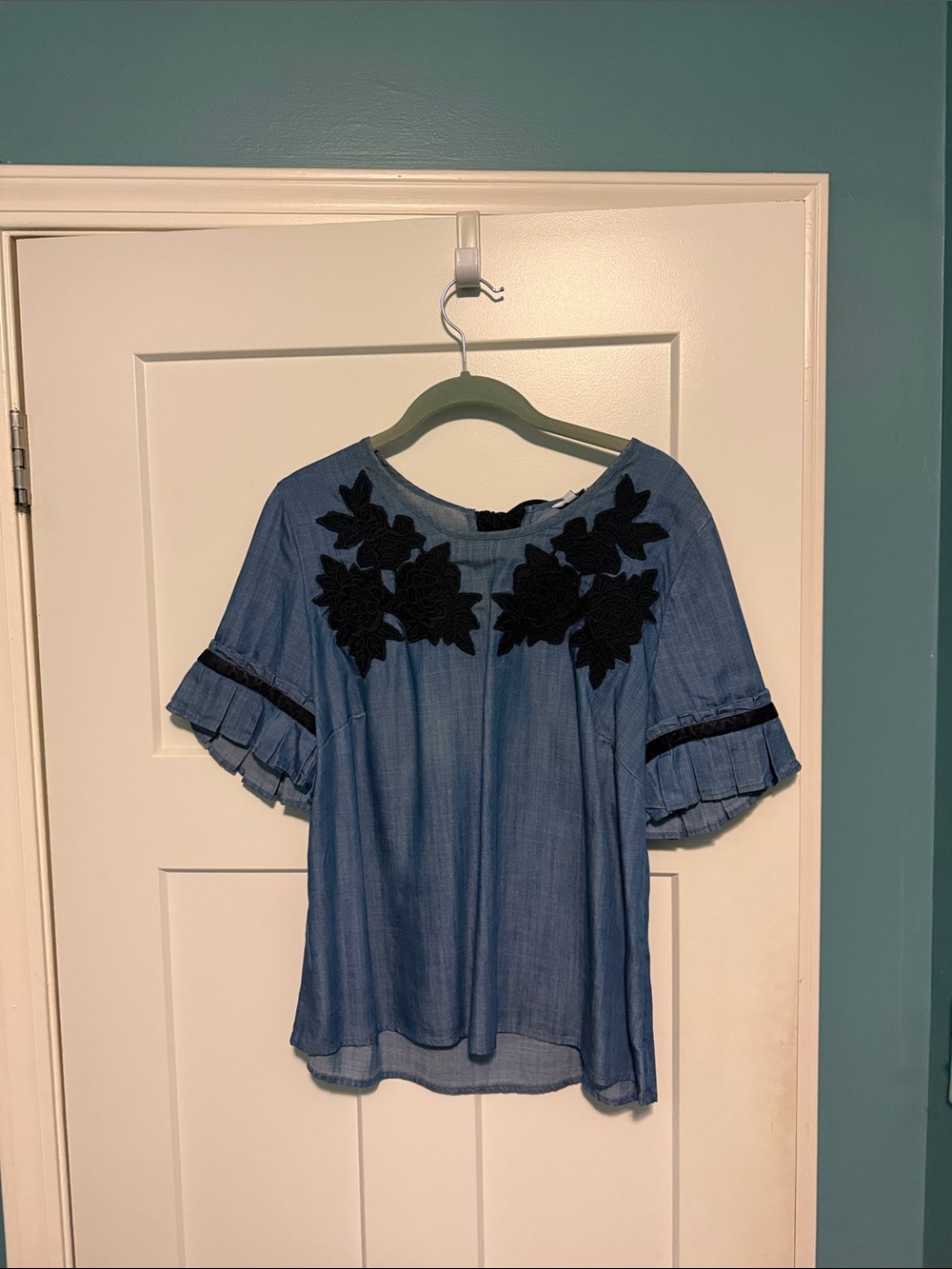 crown & ivy Blue Chambray Top with Black Floral Appliqué